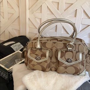 *SOLD*Authentic Coach hand bag with gold lining.
